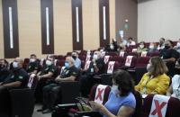 Plateia assistindo a apresentação do Sistema Frota 