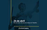 Card de divulgação do Dia do Juiz do Trabalho. Fundo azul escuro com a deusa da justiça com listas amarelas 