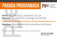 Cartão com fundo branco e grafismos em laranja anunciando a Parada Programada do Sistema PJe