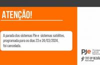 Arte gráfica onde lê-se: Atenção! A parada dos sistemas PJe e sistemas satélites foi cancelada.
