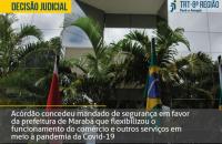 Arte: Fachada do prédio do TRT8. No topo, à esquerda, em amarelo, escrito decisão judicial.